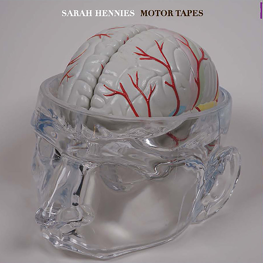 Album cover featuring a clear plastic sculpture of a head and brain, with red markings, on a white background with the text 'SARAH HENNIES MOTOR TAPES'.