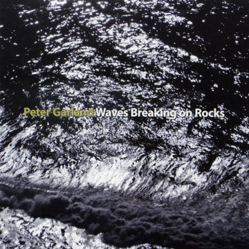 Cover art for Peter Garland's album 'Waves Breaking on Rocks' featuring a black and white photograph of water flowing over rocks with the album title in yellow text.