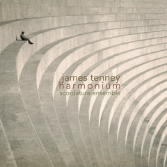 Album cover featuring a person sitting on a bench looking out over a large, open space with curved lines in the background, with the text 'james tenney harmonium scordatura ensemble'.